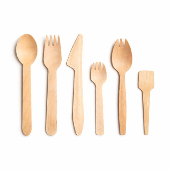 Set of wooden cutlery including spoons and forks on a white background