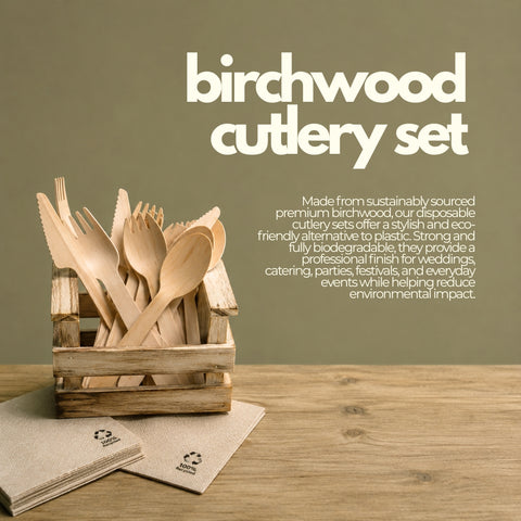Birchwood cutlery set with wooden spoons, forks, and knives in a crate on a wooden surface.